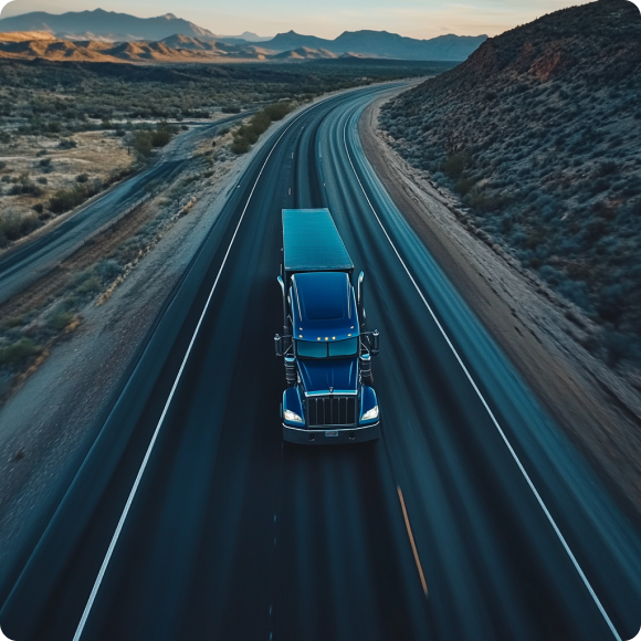 a truck driving down the road representing nationwide and cross-border services by DL Transport